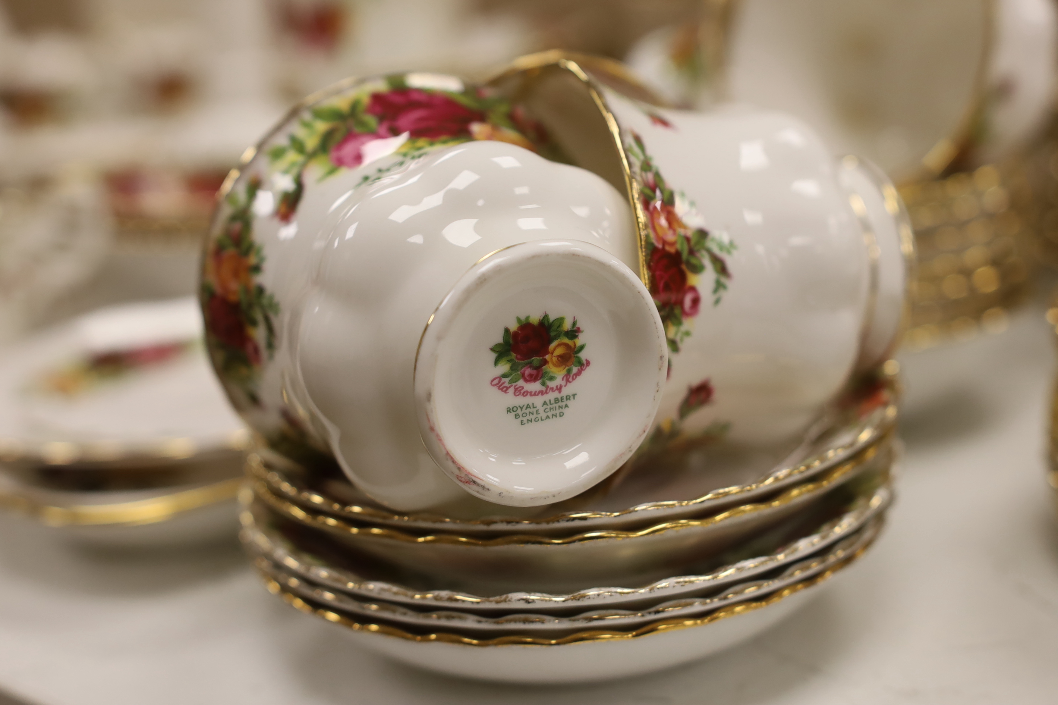A Royal Albert Old Crown Roses dinner and tea service and a Doulton Lambeth vase